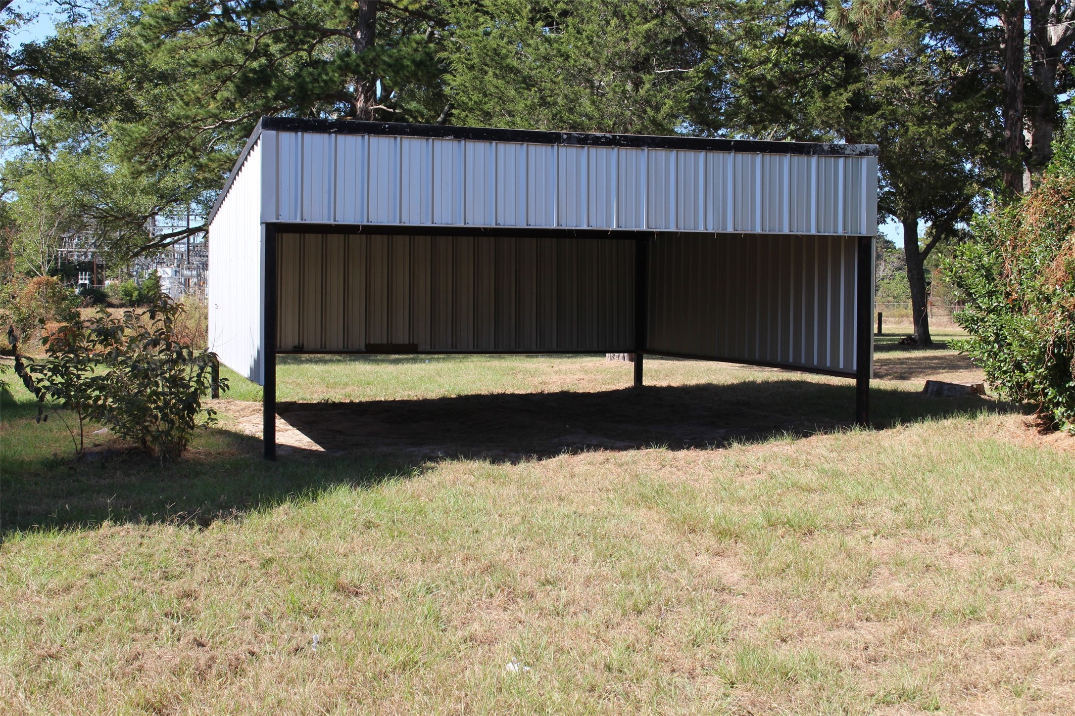 312 North Howard Street Grapeland, TX 75844 - Photo 5 of 29 a view of a backyard with a sink and wooden fence