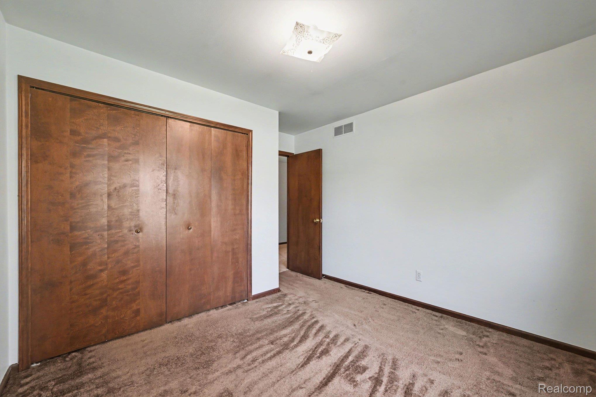 33593 Curtis Road Livonia, MI 48152 - Photo 22 of 30 Unfurnished bedroom with light carpet and a closet