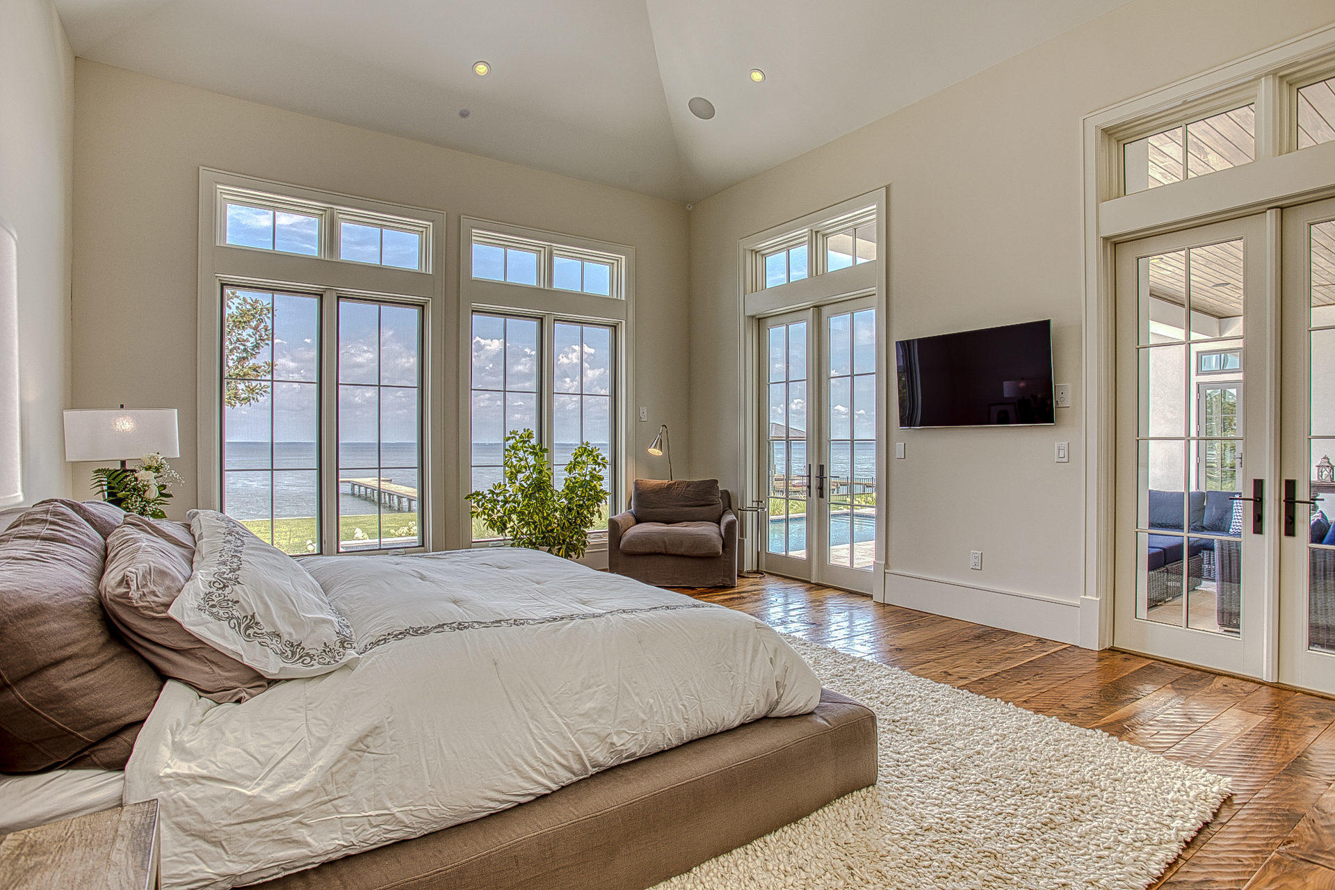 1023 Driftwood Point Road Santa Rosa Beach, FL 32459 - Photo 21 of 38 a spacious bedroom with a large bed and a flat screen tv