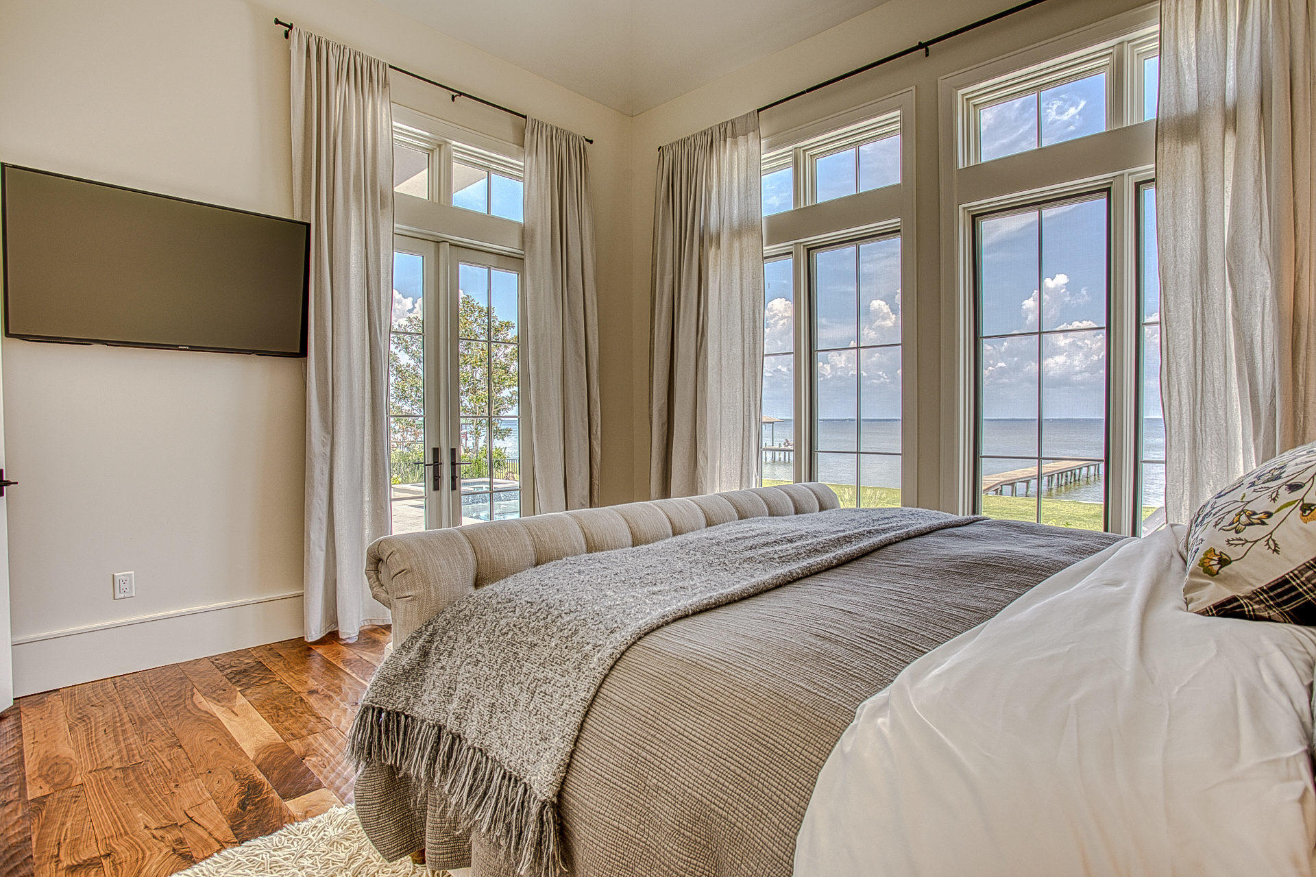 1023 Driftwood Point Road Santa Rosa Beach, FL 32459 - Photo 27 of 38 a bedroom with a large bed and a flat tv screen