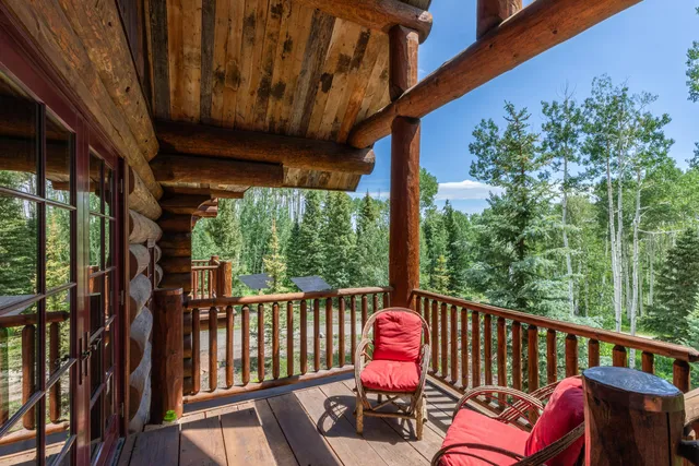 a bedroom with a bed and a book shelf