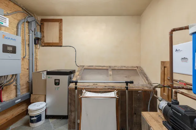 a view of a house with pool and a yard