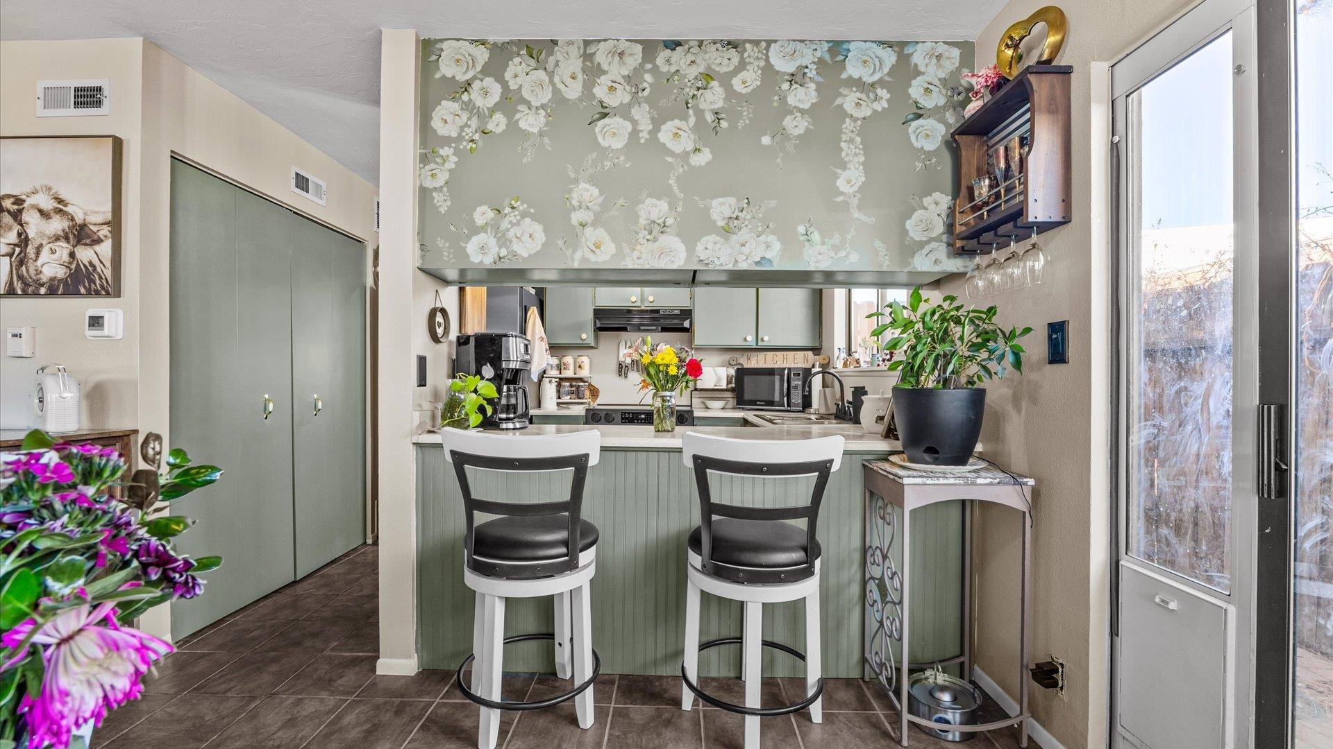517-28 28 1/2 Road, Unit 4E Grand Junction, CO 81501 - Photo 6 of 15 a dining room with furniture and a potted plant