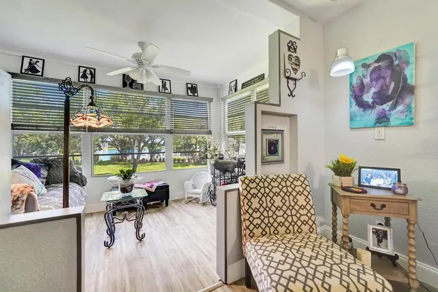 a view of a livingroom with furniture and a potted plant