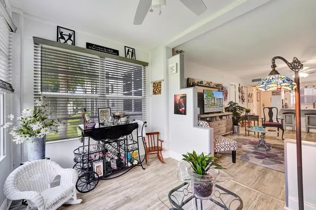 a bedroom with a bed dresser and a window