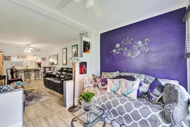 a bed room with a bed and a large mirror