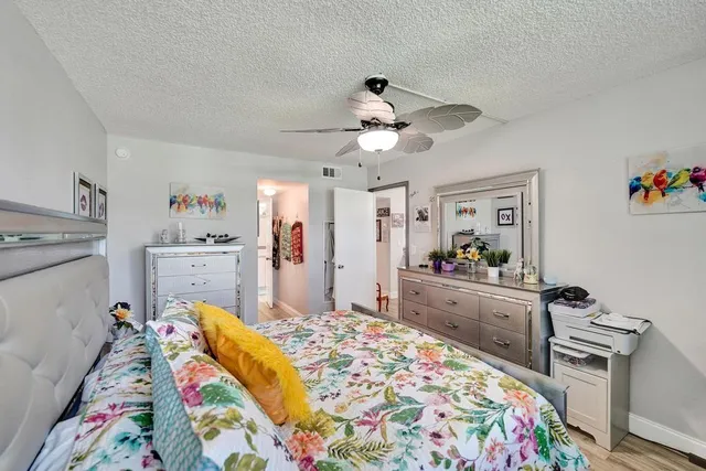 a room with a bed and a large window