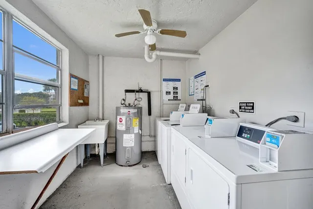 a view of a street with flower plants