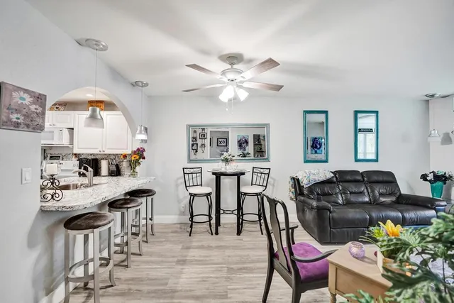 a view of a dining room with furniture and wooden floor