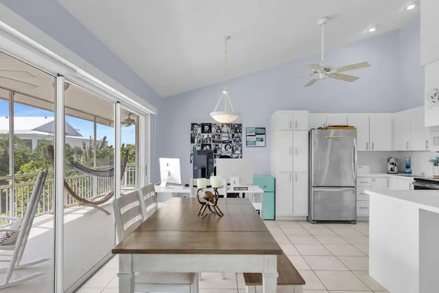 a kitchen with kitchen island a counter top space a sink and stainless steel appliances