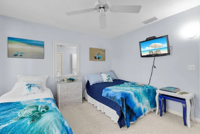 a bedroom with a bed and a table