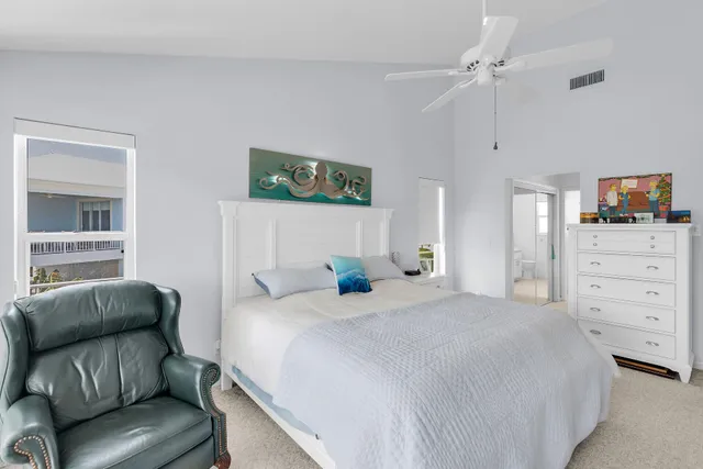 a bedroom with a bed and a couch