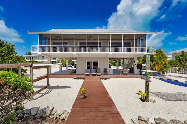 a front view of a building with sitting area