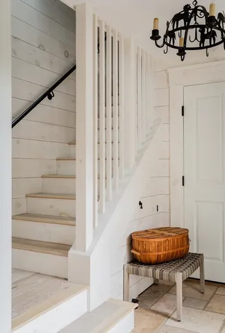 a balcony with a table and chairs