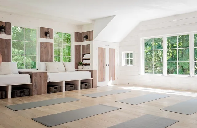a living room with furniture and windows