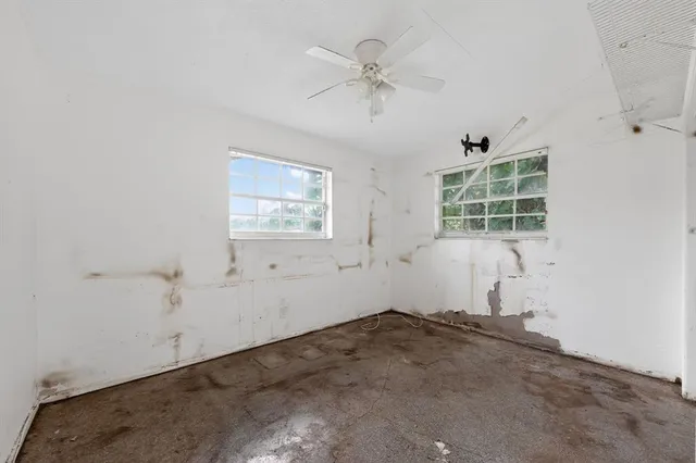 an empty room with windows