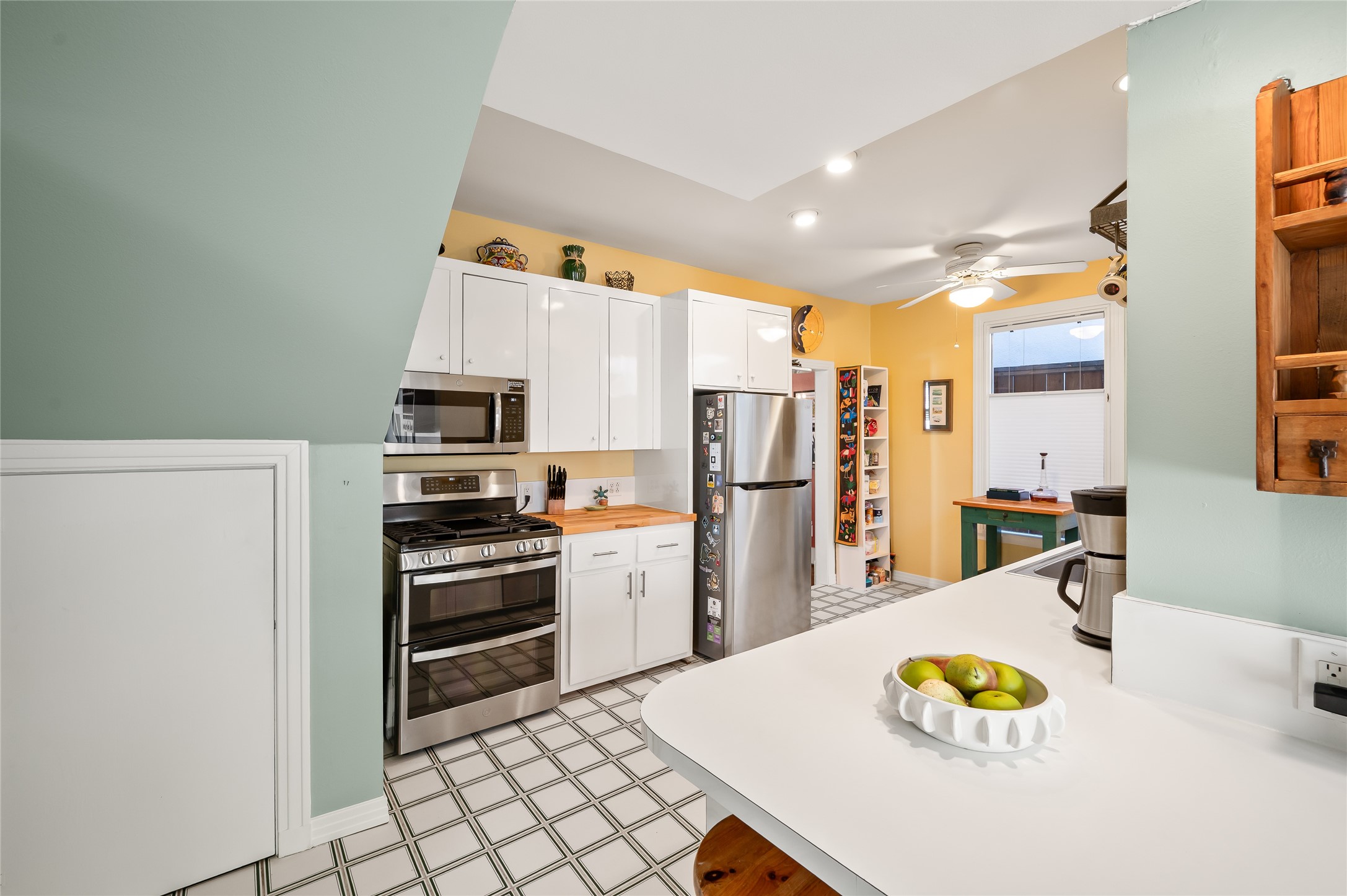 1534 Harold Street Houston, TX 77006 - Photo 13 of 41 a kitchen with stainless steel appliances a refrigerator and a stove