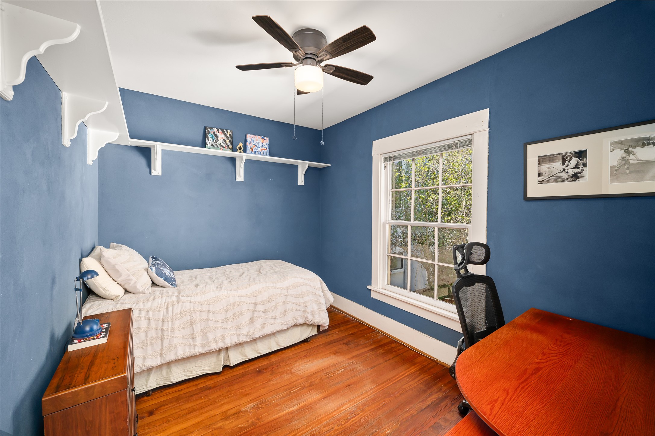 1534 Harold Street Houston, TX 77006 - Photo 20 of 41 a bed room with a bed and a chair