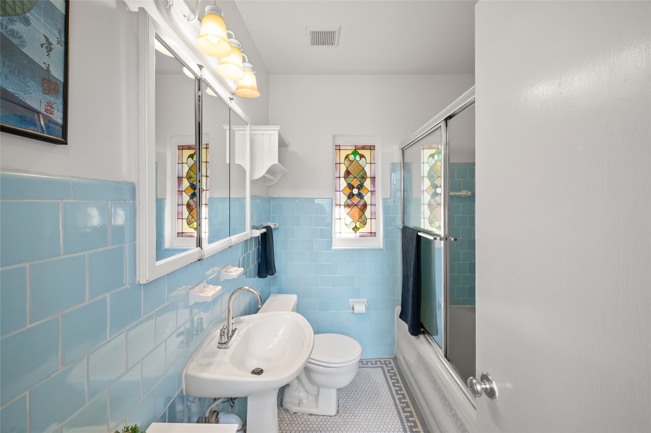 1534 Harold Street Houston, TX 77006 - Photo 24 of 41 a bathroom with a toilet sink and mirror