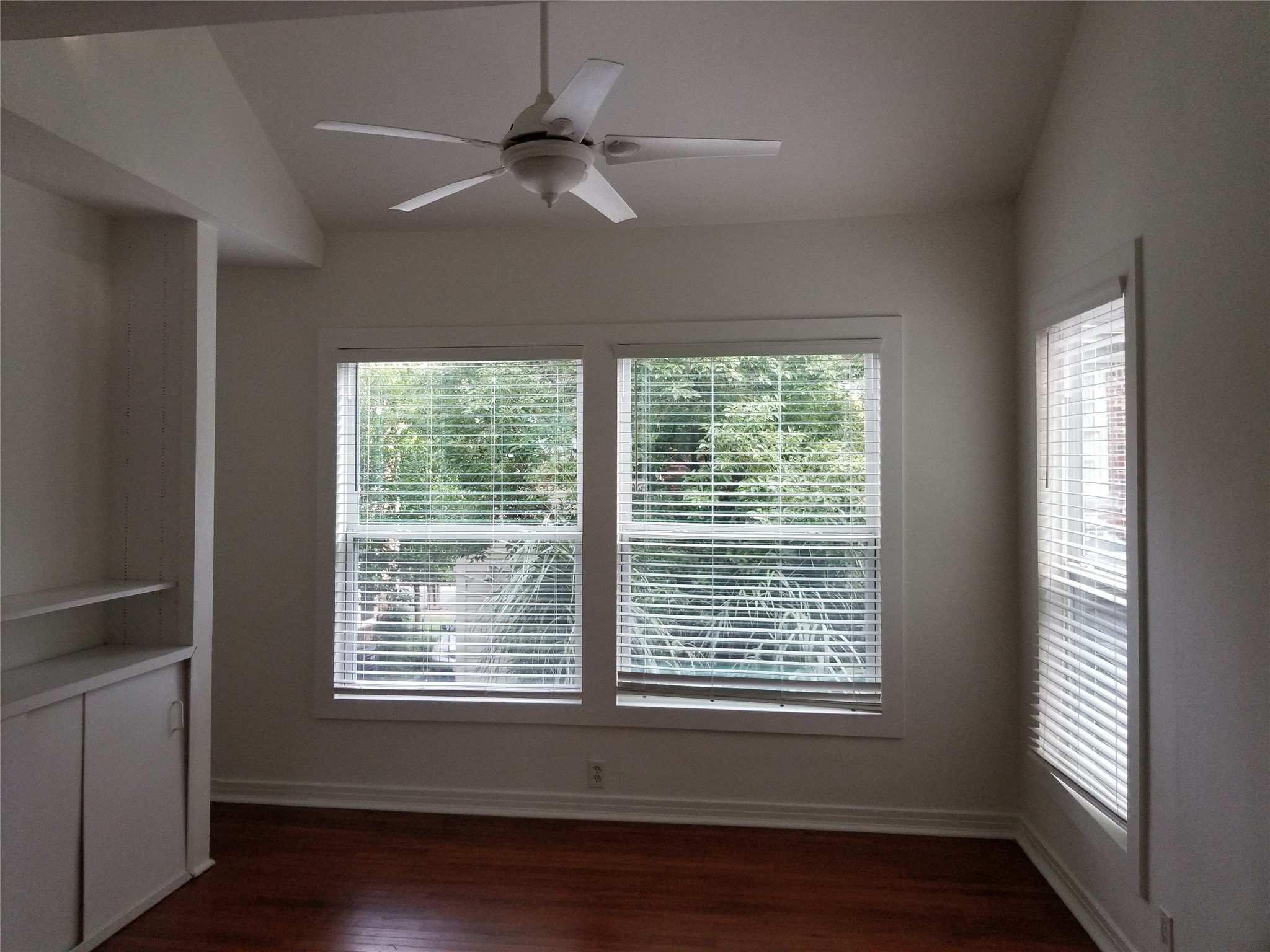 1534 Harold Street Houston, TX 77006 - Photo 36 of 41 a view of an empty room with wooden floor and a window