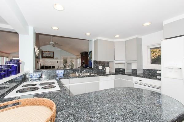 50 River Road Gloucester, MA 01930 - Photo 11 of 33 a kitchen with sink stove and cabinets