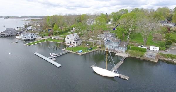 50 River Road Gloucester, MA 01930 - Photo 2 of 33 an aerial view of a house with swimming pool patio and lake view