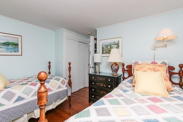 50 River Road Gloucester, MA 01930 - Photo 25 of 33 a bedroom with a bed and wooden floor