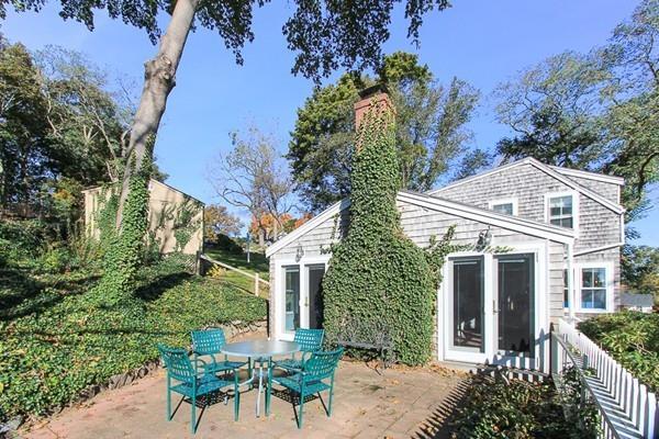 50 River Road Gloucester, MA 01930 - Photo 29 of 33 front view of a house with a yard and potted plants