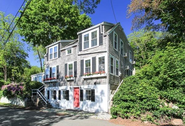 50 River Road Gloucester, MA 01930 - Photo 4 of 33 a front view of a house with a yard