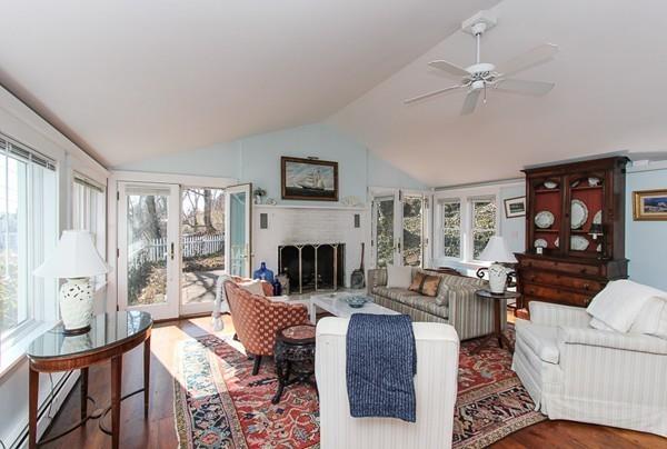 50 River Road Gloucester, MA 01930 - Photo 7 of 33 a living room with furniture a fireplace and a large window