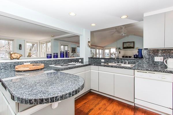 50 River Road Gloucester, MA 01930 - Photo 10 of 33 a kitchen with stainless steel appliances granite countertop a sink stove and cabinets