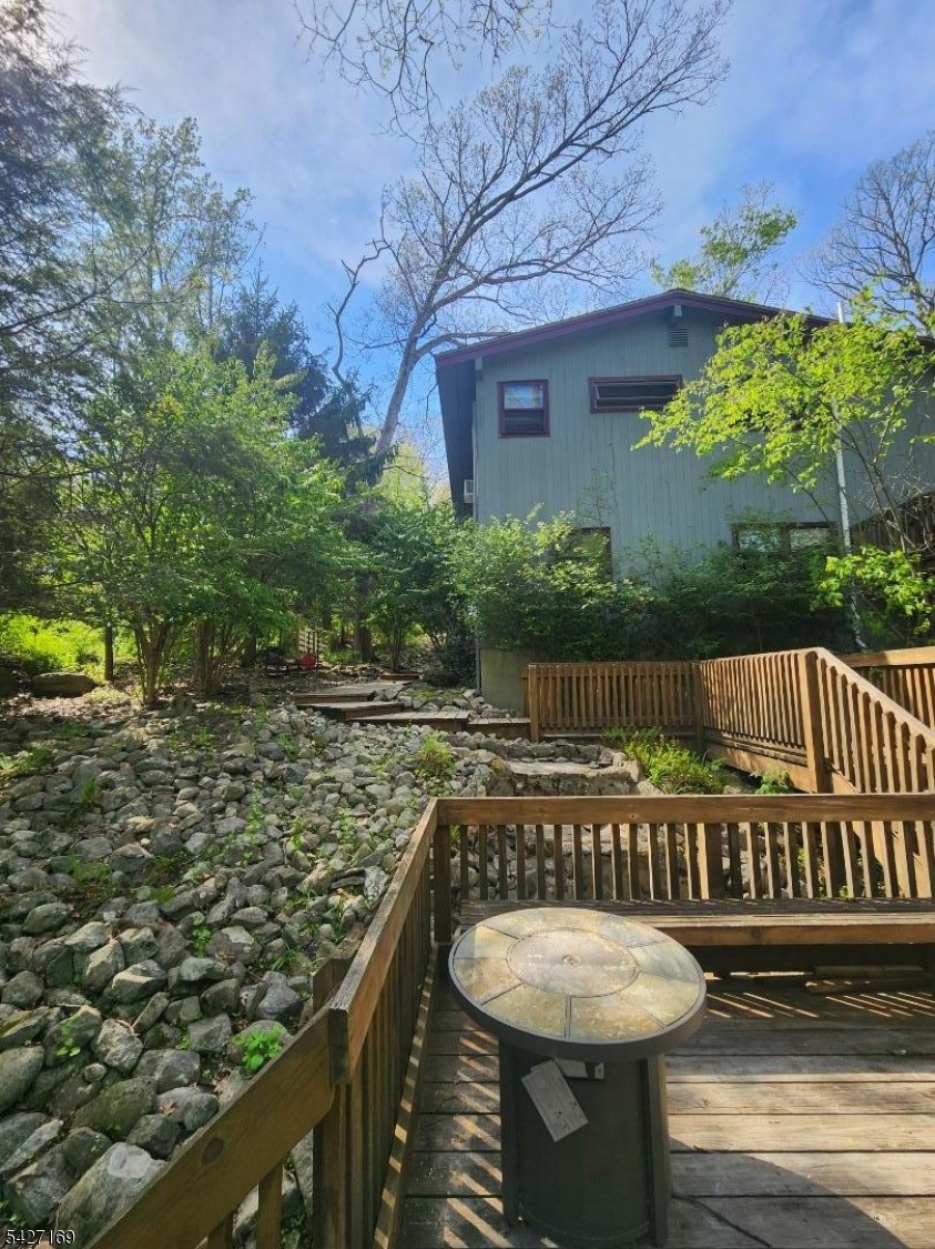 41 Crescent Drive South Andover, NJ 07821 - Photo 17 of 29 a view of a chair and tables on the deck