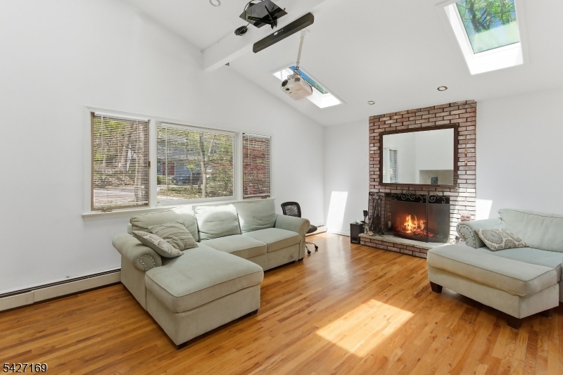 41 Crescent Drive South Andover, NJ 07821 - Photo 7 of 29 a living room with furniture and a fireplace