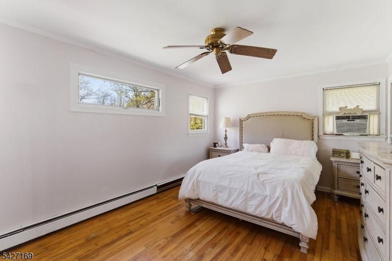 41 Crescent Drive South Andover, NJ 07821 - Photo 9 of 29 a bedroom with a bed and wooden floor