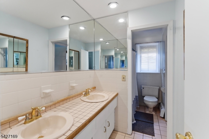 41 Crescent Drive South Andover, NJ 07821 - Photo 10 of 29 a bathroom with a sink double vanity and a mirror
