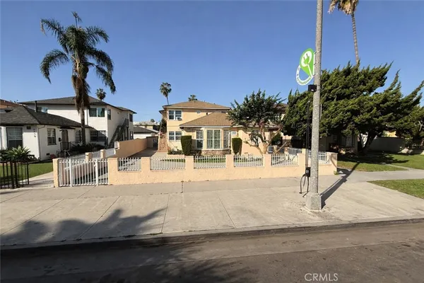a view of a house with palm tree