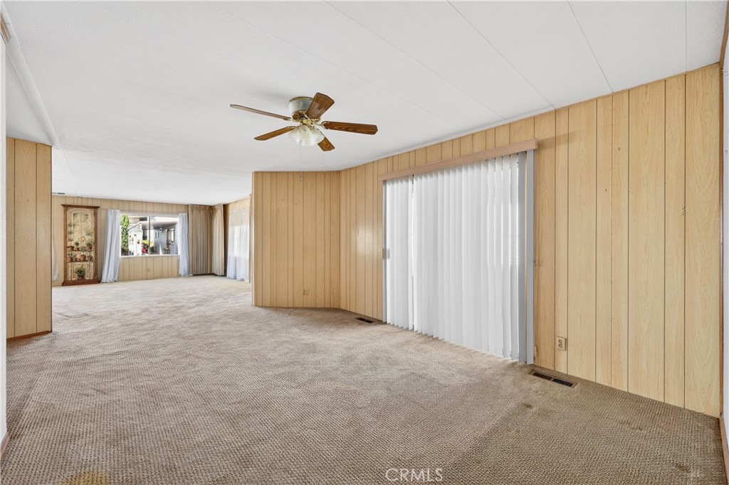 1001 West Lambert Road, Unit 258 La Habra, CA 90631 - Photo 17 of 75 a view of a livingroom with a ceiling fan and window