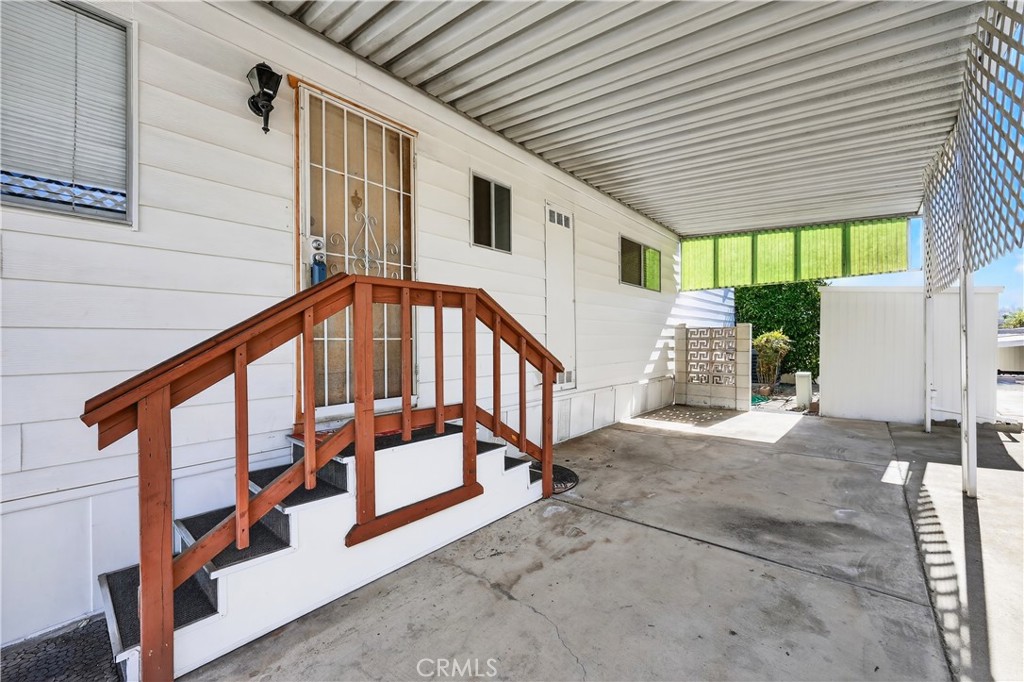 1001 West Lambert Road, Unit 258 La Habra, CA 90631 - Photo 36 of 75 a view of staircase with large window and wooden fence