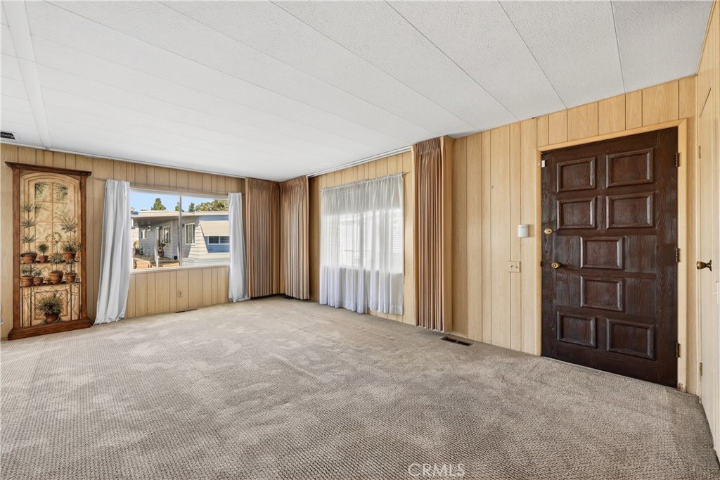 1001 West Lambert Road, Unit 258 La Habra, CA 90631 - Photo 5 of 75 an empty room with windows and closet