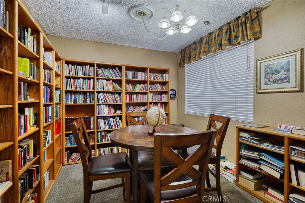 1001 West Lambert Road, Unit 258 La Habra, CA 90631 - Photo 72 of 75 a view of a dining room with furniture and a book shelf
