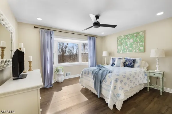 a bedroom with a large bed and a window