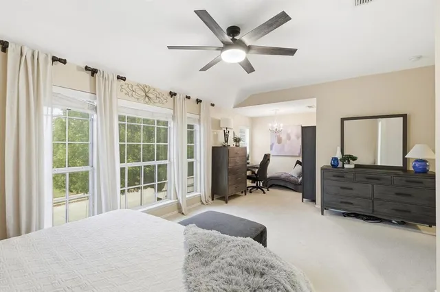 a view of a livingroom with furniture and a chandelier