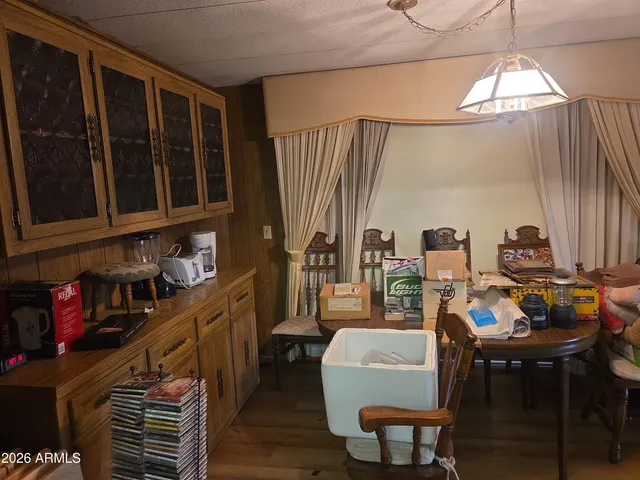 a view of a dining room with furniture window and outside view