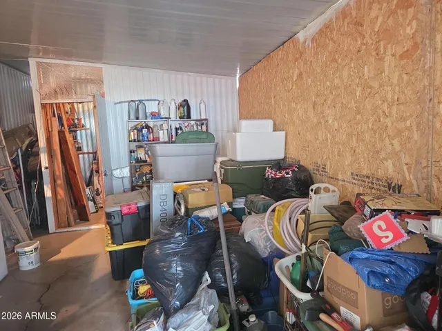 a bed room with a bed and a desk