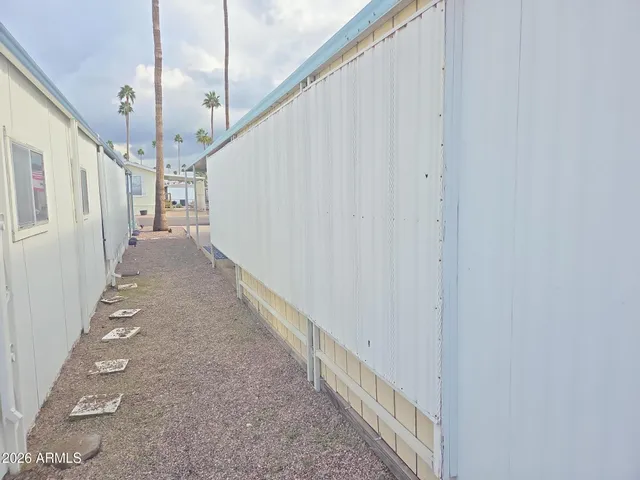 a view of a hallway with stairs