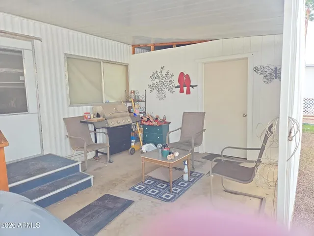 a living room with furniture and a table