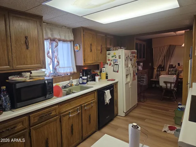 a kitchen with stainless steel appliances a refrigerator and a stove