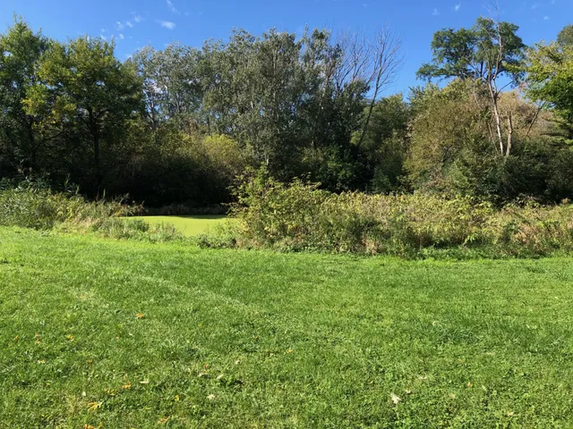 a view of a water with an outdoor space and seating
