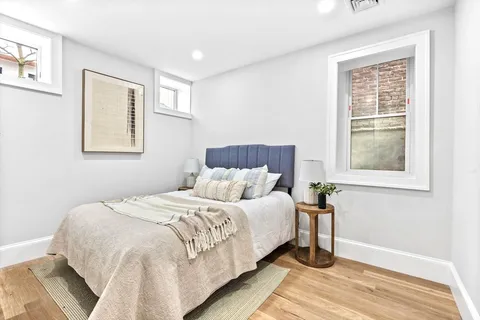 a bedroom with a bed and a table in it