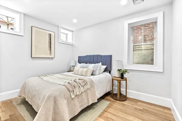 a bedroom with a bed and a table in it